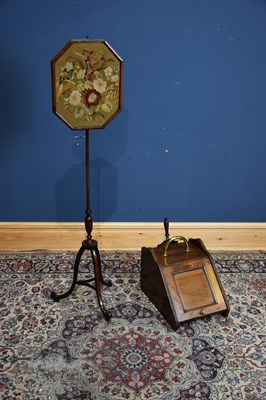 Lot 130 - A 19th century pole screen with tapestry panel...