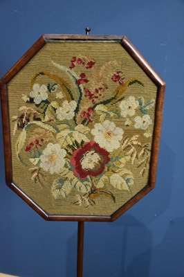 Lot 130 - A 19th century pole screen with tapestry panel...