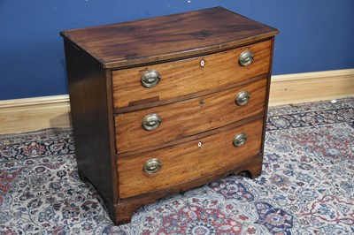 Lot 69 - A Georgian mahogany bowfronted chest of three...