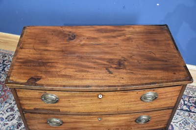 Lot 69 - A Georgian mahogany bowfronted chest of three...