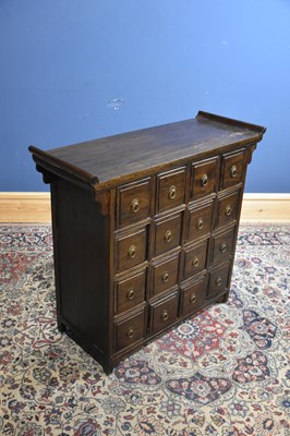 Lot 213 - A modern Chinese chest of sixteen drawers,...