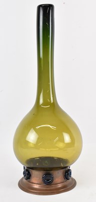 Lot 546 - An early 20th century hand blown olive glass...