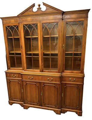Lot 32 - A reproduction bookcase, with pair of glazed...