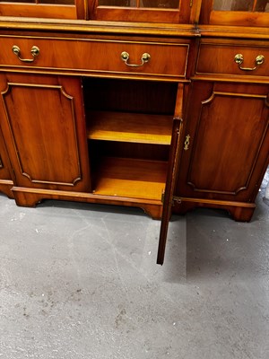 Lot 32 - A reproduction bookcase, with pair of glazed...