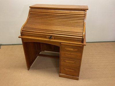 Lot 628 - A roll-top desk, height 117cm, width 107cm,...