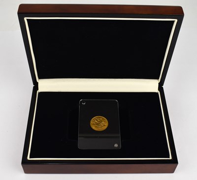 Lot 676 - A George V half sovereign 1911, in Perspex...