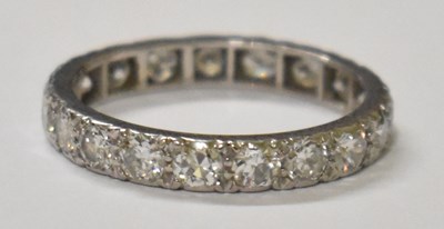 Lot 779 - A white metal diamond set full eternity ring,...