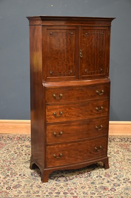 Lot 20 - A 1920s mahogany bowfront cocktail cabinet,...