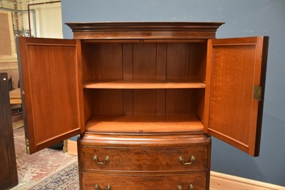 Lot 20 - A 1920s mahogany bowfront cocktail cabinet,...