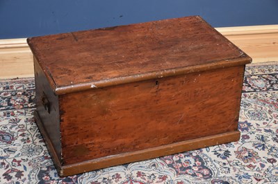 Lot 297 - An old stained pine blanket chest, with cast...