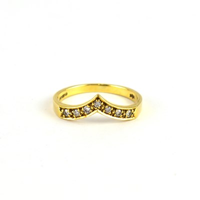 Lot 769 - A 9ct gold wishbone ring set with small white...