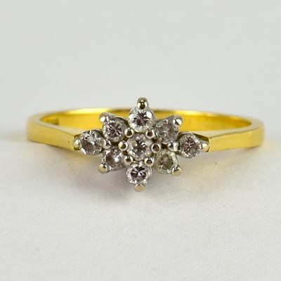 Lot 732 - An 18ct gold diamond cluster ring, the...