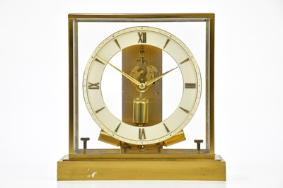 Lot 2141 - JUNGHANS; a brass cased 'ATO' clock, the dial...