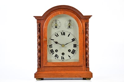 Lot 2131 - A 1920s oak cased mantel clock, with arched...