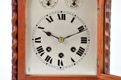 Lot 2131 - A 1920s oak cased mantel clock, with arched...