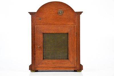Lot 2131 - A 1920s oak cased mantel clock, with arched...