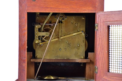 Lot 2131 - A 1920s oak cased mantel clock, with arched...