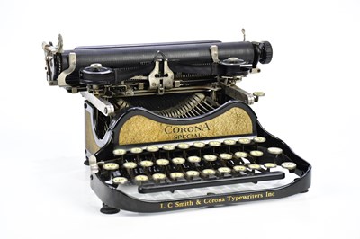 Lot 1085 - L C SMITH & CORONA; a vintage cased typewriter.