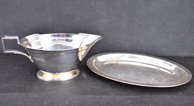 Lot 657 - An Elizabeth II hallmarked silver sauce boat,...