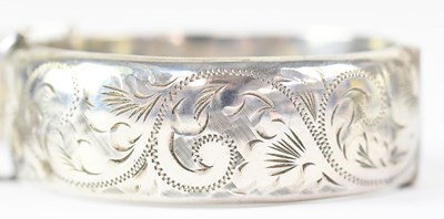 Lot 817 - Two hallmarked silver hinged bangles, a...