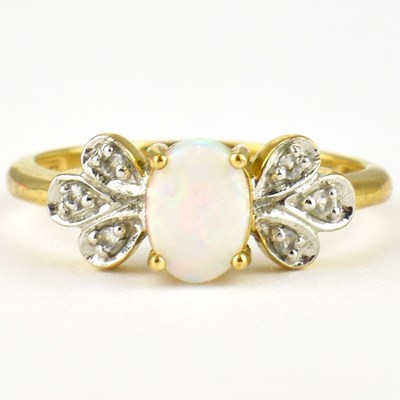 Lot 755 - A 9ct gold dress ring, set with an opal...