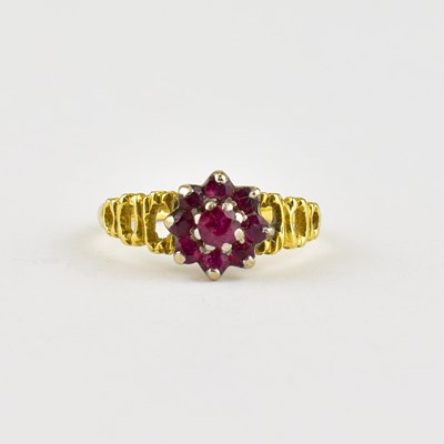 Lot 740 - An 18ct gold ring, ruby cluster with three...