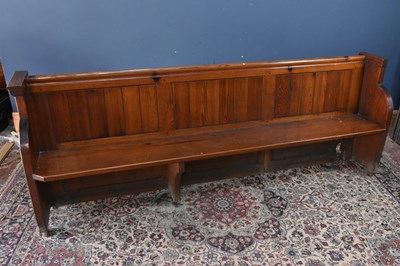 Lot 280 - A 19th century pitch pine pew, height 91cm,...