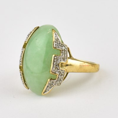 Lot 758 - A 9ct gold ring set with oval pale green jade...