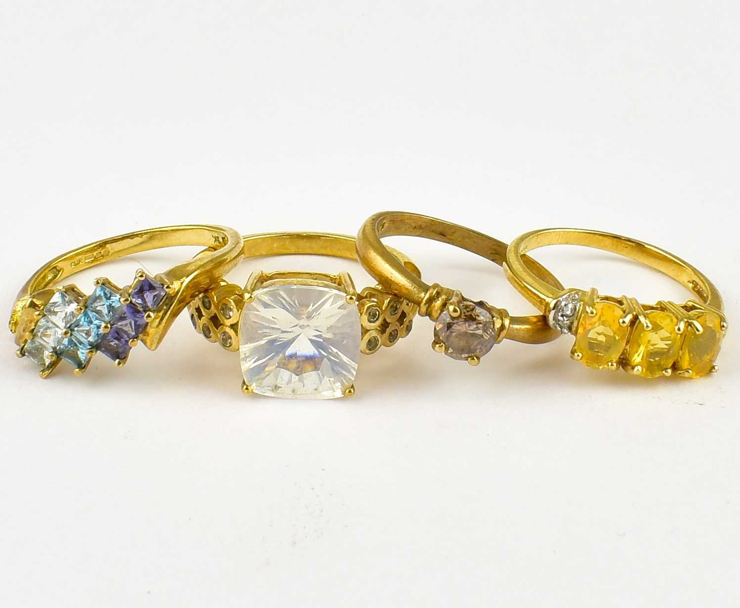 Lot 795 - Four 9ct gold gem set dress rings, sizes Q,
