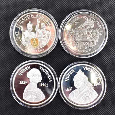 Lot 695 - Four Elizabeth II commemorative 925 silver...