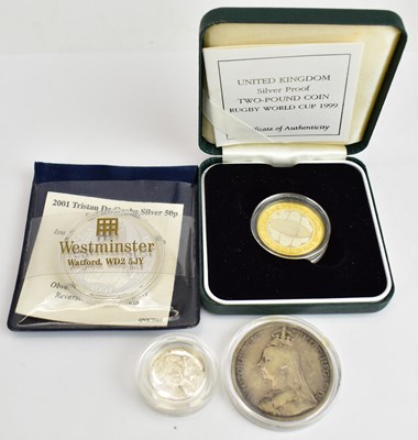 Lot 696 - Four silver coins comprising Royal Mint silver...