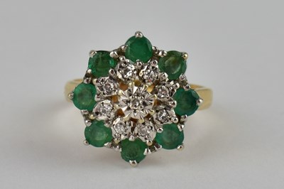 Lot 770 - A 9ct ring with diamond and emerald cluster,...