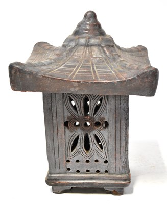 Lot 423 - A pottery lantern in the form of a pagoda,...