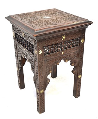 Lot 45 - An Indian carved side table with inlaid mother...