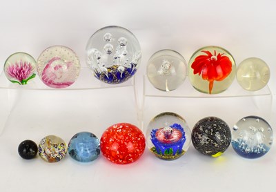 Lot 348 - Twelve paperweights of various sizes and...