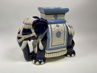 Lot 216 - A ceramic elephant plant stand, height 42cm.