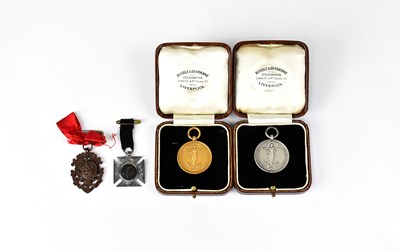 Lot 375 - Three Liverpool related medals, comprising two...