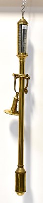 Lot 138 - A mid-20th century brass cased gimbal mounted...