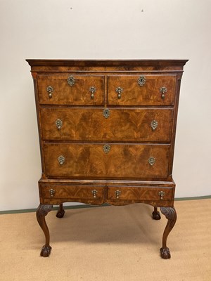 Lot 671 - An early 20th century walnut veneered chest on...