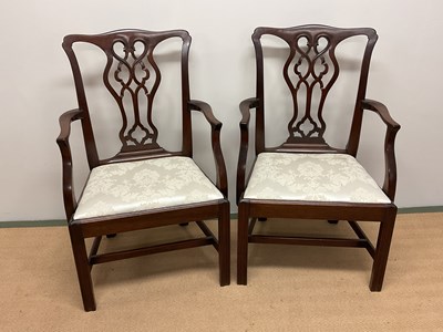 Lot 699 - A pair of Georgian ribbon back mahogany elbow...