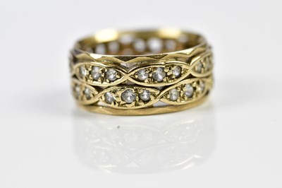 Lot 154 - A yellow metal double row pierced dress ring,...