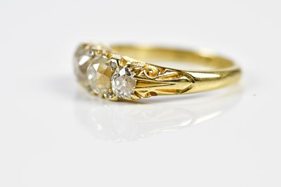 Lot 75 - An 18ct yellow gold four stone diamond ring,...