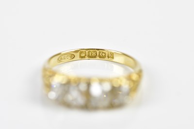 Lot 75 - An 18ct yellow gold four stone diamond ring,...