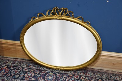 Lot 67 - A 19th century oval form gilt wall mirror with...