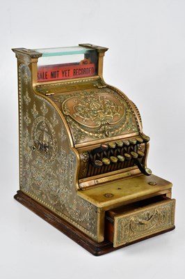 Lot 1002 - NATIONAL; a brass cash register of small...