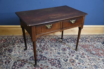 Lot 300 - An 18th century oak two drawer side table on...