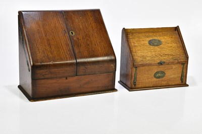 Lot 1072 - A 1920s oak stationery box, the two doors...