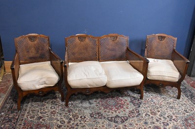 Lot 47 - An early 20th century three piece Bergere suite.