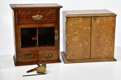 Lot 1039 - A 1920s oak smoker's cabinet with arrangement...