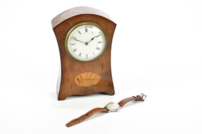 Lot 2148 - An Edwardian inlaid mahogany mantel clock, the...